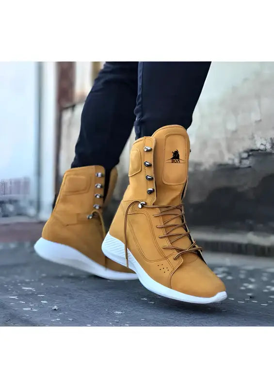 Tan leather high-top boots with white soles and laces.