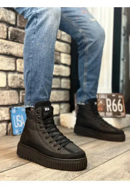 Black high-top platform sneakers with thick soles and laces.