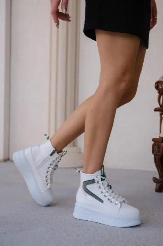 White platform high-top sneakers with gray accents.