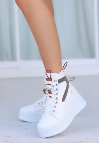 White high-top platform sneaker with gray accents and white laces.