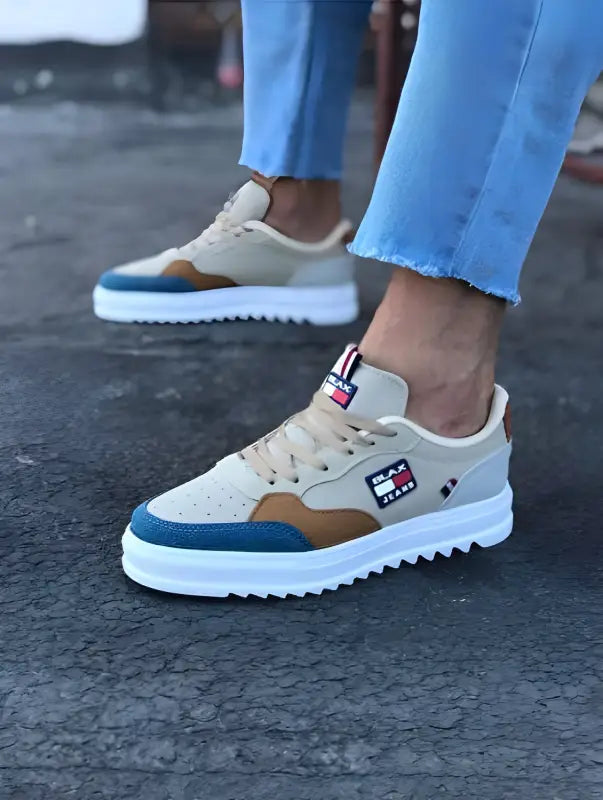 Casual white and brown sneakers with blue accents and a chunky platform sole.