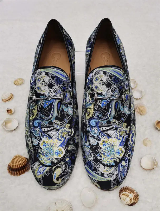 Decorative loafers featuring a blue and black celestial pattern with moons and stars.