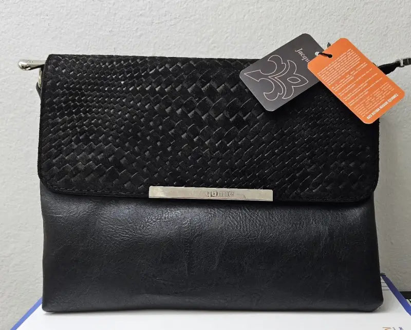 Black woven leather clutch bag with a metal nameplate detail.