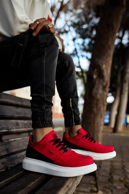 Red sneakers with black laces and white platform soles.