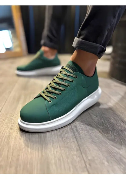 Forest green sneaker with white platform sole and matching laces.