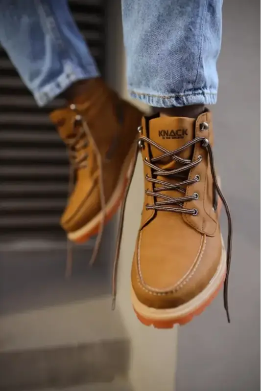 Tan leather work boot with brown laces and a rugged sole.