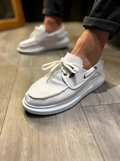 White mesh boat shoe with a thick sole and laces.