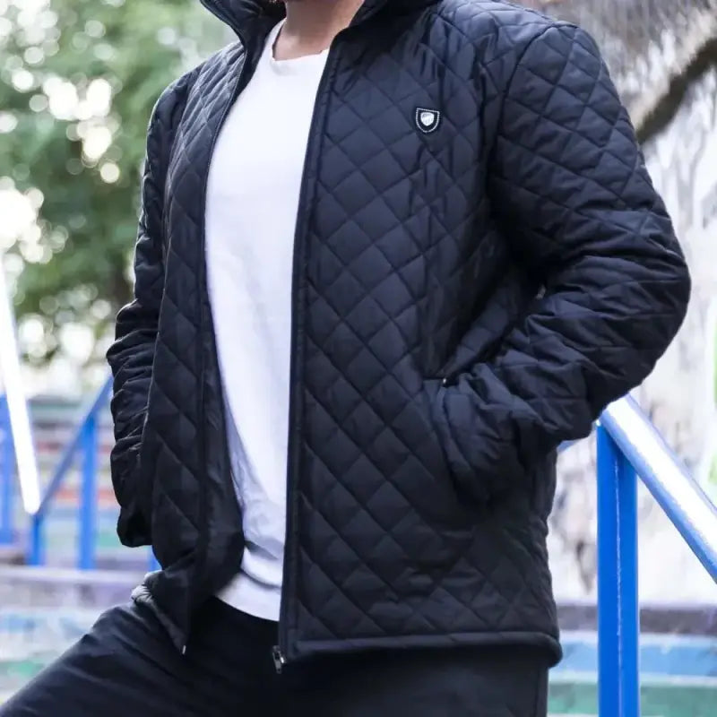 Navy blue quilted bomber jacket with a small logo emblem.