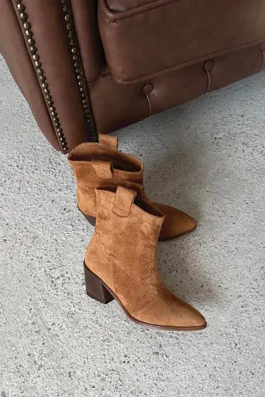 Tan suede western-style boots with a chunky heel.